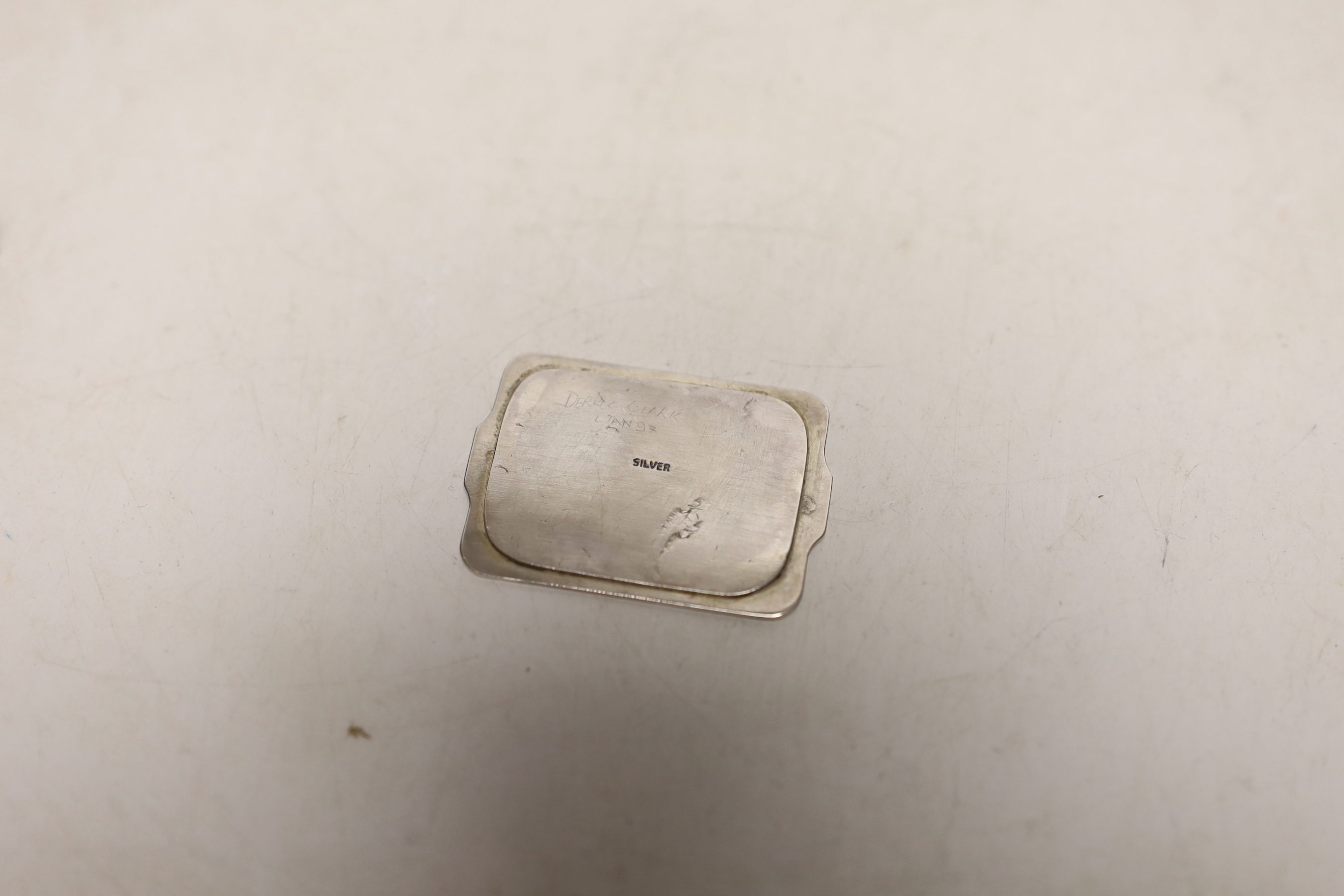 An Edwardian miniature table, 45mm and single chair, by Levi & Salaman, Birmingham, 1902, a later silver single chair, two other white metal miniature chairs and a similar settee.